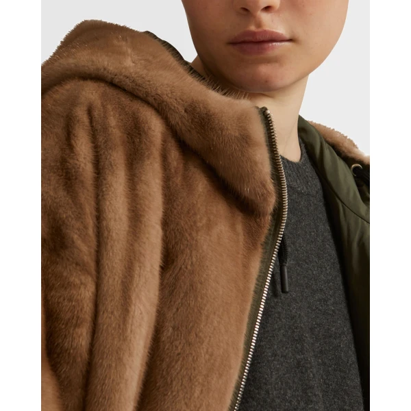 Woman wearing Yves Salomon shearling fur coat – luxury outerwear at Coveti