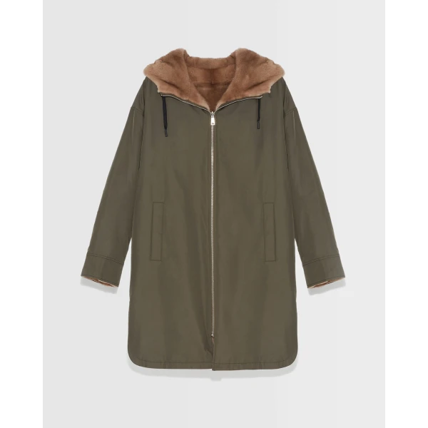 Woman wearing Yves Salomon shearling fur coat – luxury outerwear at Coveti