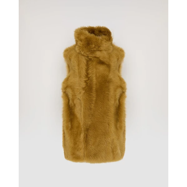 Woman wearing Yves Salomon shearling fur coat – luxury outerwear at Coveti
