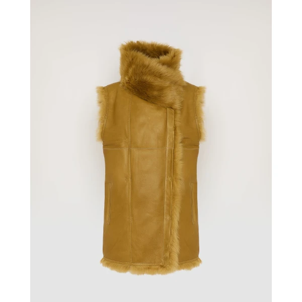 Woman wearing Yves Salomon shearling fur coat – luxury outerwear at Coveti