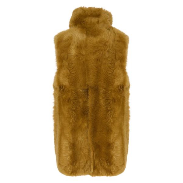 Woman wearing Yves Salomon shearling fur coat – luxury outerwear at Coveti