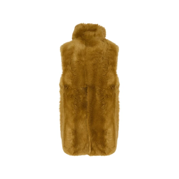 Woman wearing Yves Salomon shearling fur coat – luxury outerwear at Coveti