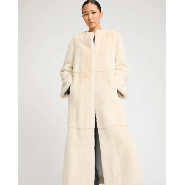 Woman wearing Yves Salomon shearling fur coat – luxury outerwear at Coveti