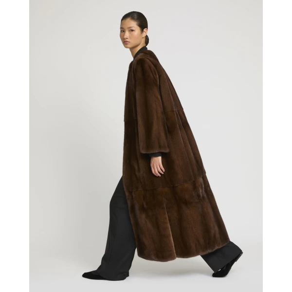 Woman wearing Yves Salomon shearling fur coat – luxury outerwear at Coveti