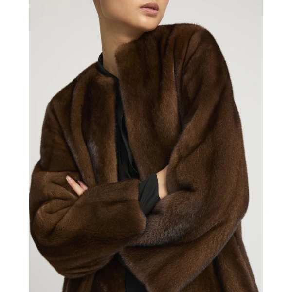 Woman wearing Yves Salomon shearling fur coat – luxury outerwear at Coveti