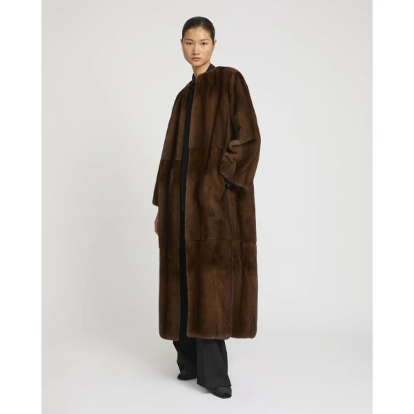Woman wearing Yves Salomon shearling fur coat – luxury outerwear at Coveti