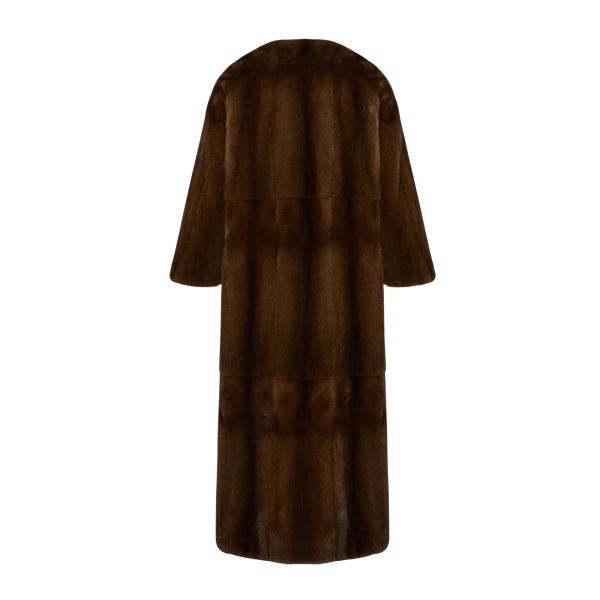 Woman wearing Yves Salomon shearling fur coat – luxury outerwear at Coveti