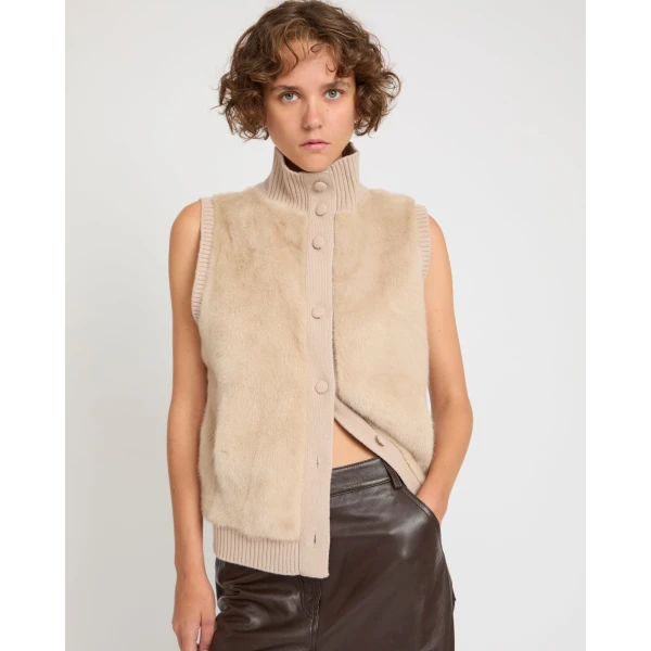 Woman wearing Yves Salomon shearling fur coat – luxury outerwear at Coveti