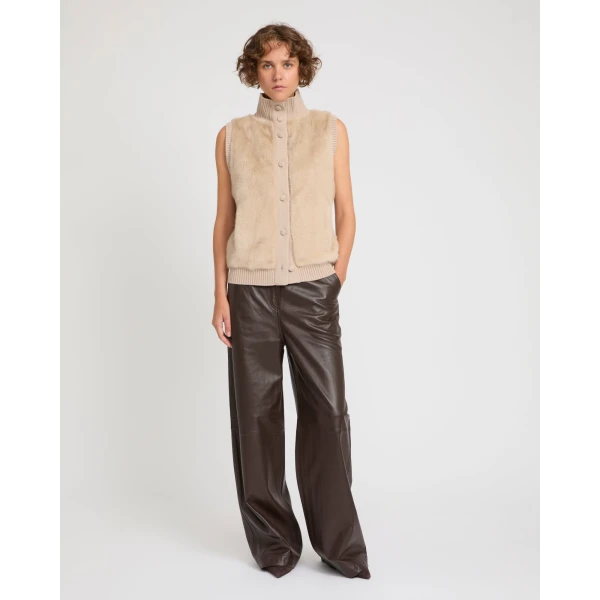 Woman wearing Yves Salomon shearling fur coat – luxury outerwear at Coveti
