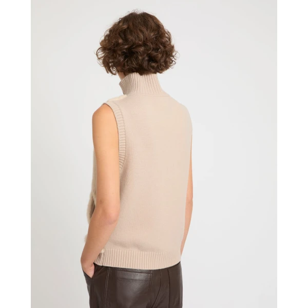 Woman wearing Yves Salomon shearling fur coat – luxury outerwear at Coveti