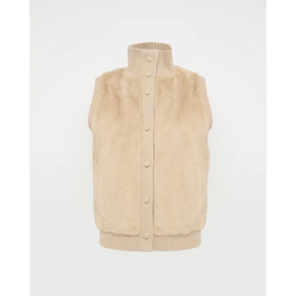 Woman wearing Yves Salomon shearling fur coat – luxury outerwear at Coveti
