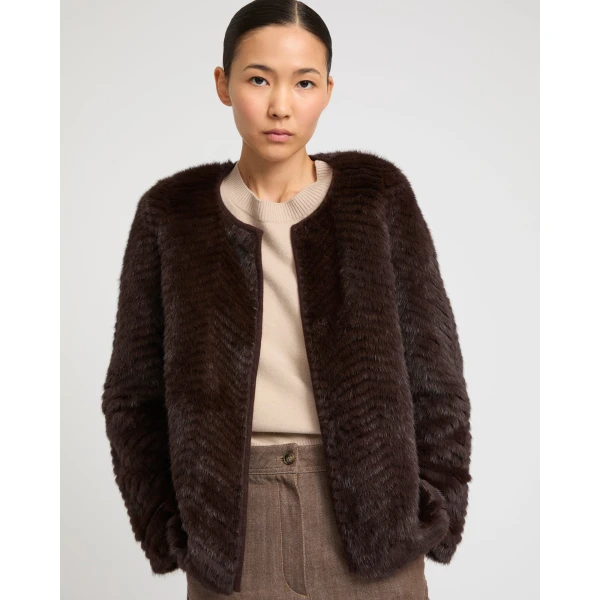 Woman wearing Yves Salomon shearling fur coat – luxury outerwear at Coveti