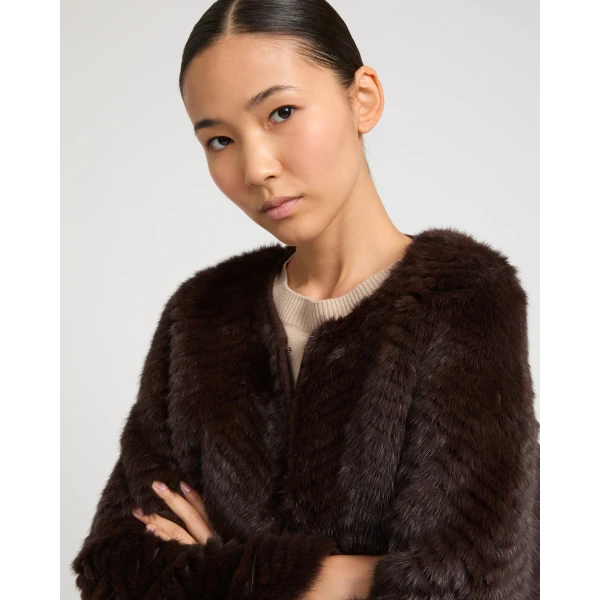 Woman wearing Yves Salomon shearling fur coat – luxury outerwear at Coveti