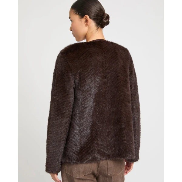 Woman wearing Yves Salomon shearling fur coat – luxury outerwear at Coveti