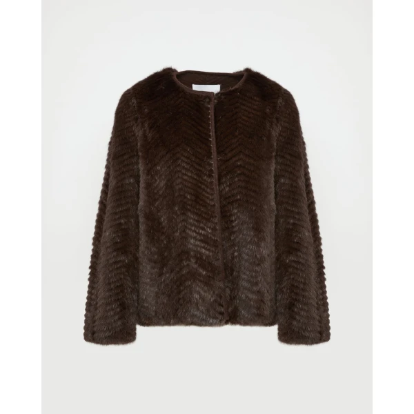 Woman wearing Yves Salomon shearling fur coat – luxury outerwear at Coveti
