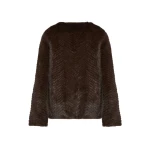 Woman wearing Yves Salomon shearling fur coat – luxury outerwear at Coveti