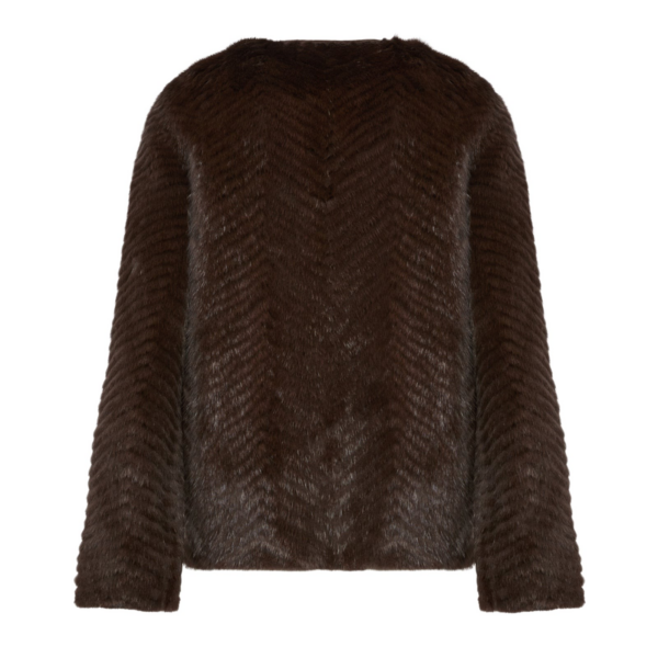 Woman wearing Yves Salomon shearling fur coat – luxury outerwear at Coveti