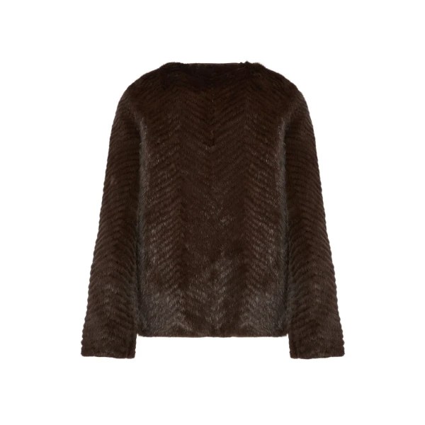 Woman wearing Yves Salomon shearling fur coat – luxury outerwear at Coveti