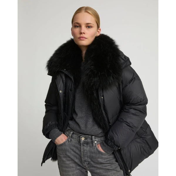 Woman wearing Yves Salomon shearling fur coat – luxury outerwear at Coveti
