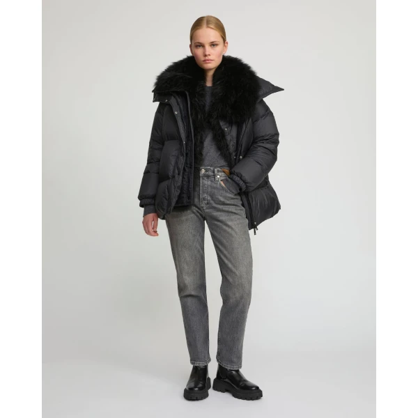 Woman wearing Yves Salomon shearling fur coat – luxury outerwear at Coveti