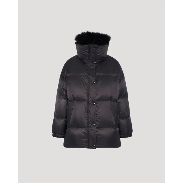 Woman wearing Yves Salomon shearling fur coat – luxury outerwear at Coveti
