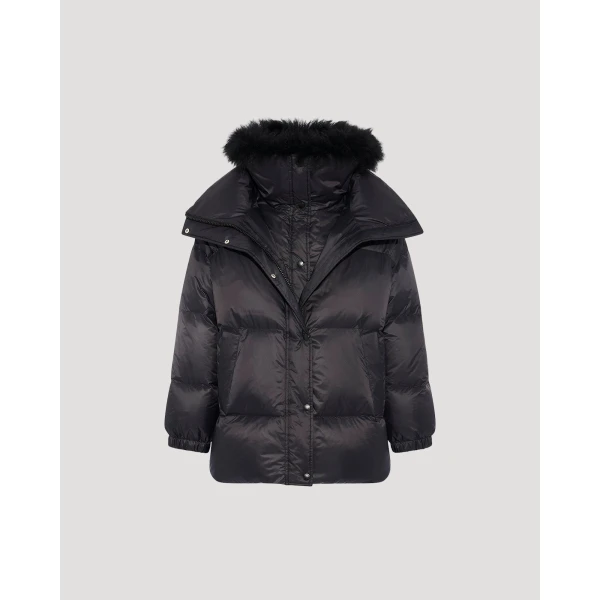 Woman wearing Yves Salomon shearling fur coat – luxury outerwear at Coveti