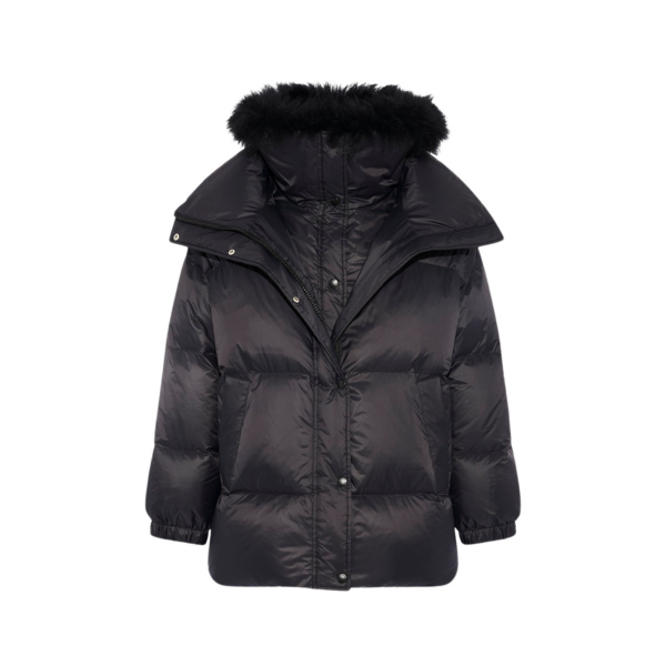 Woman wearing Yves Salomon shearling fur coat – luxury outerwear at Coveti