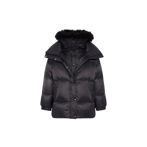 Woman wearing Yves Salomon shearling fur coat – luxury outerwear at Coveti