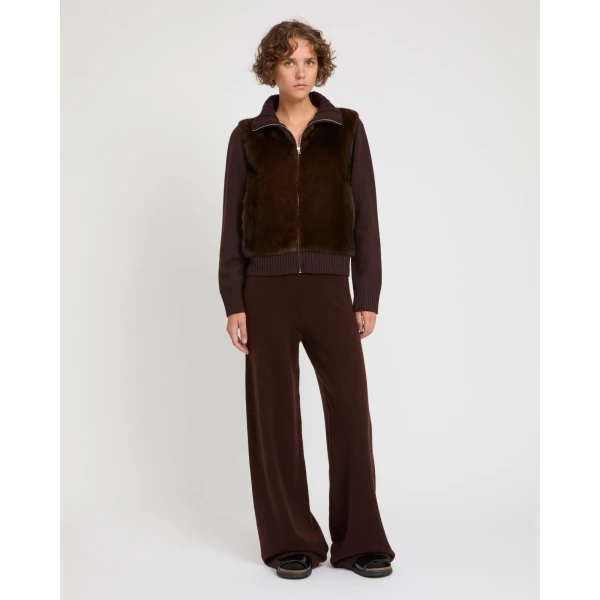 Woman wearing Yves Salomon shearling fur coat – luxury outerwear at Coveti
