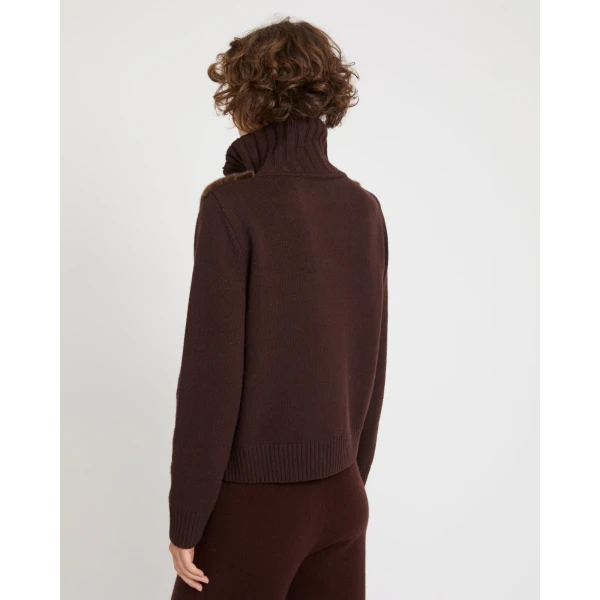 Woman wearing Yves Salomon shearling fur coat – luxury outerwear at Coveti