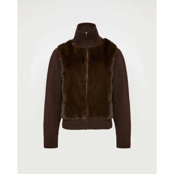 Woman wearing Yves Salomon shearling fur coat – luxury outerwear at Coveti