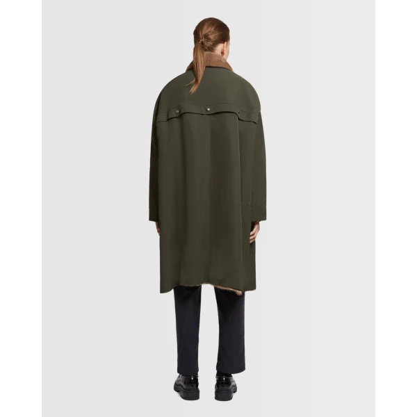 Woman wearing Yves Salomon shearling fur coat – luxury outerwear at Coveti