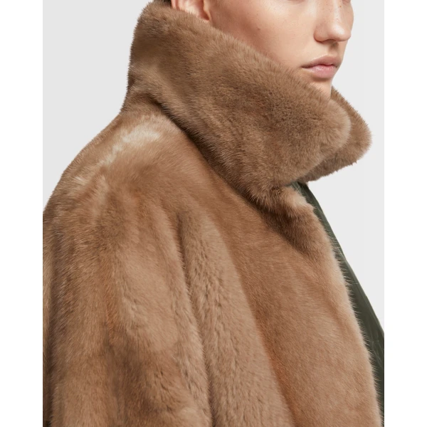 Woman wearing Yves Salomon shearling fur coat – luxury outerwear at Coveti