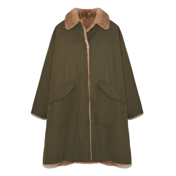 Woman wearing Yves Salomon shearling fur coat – luxury outerwear at Coveti