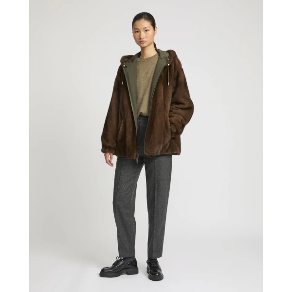 Woman wearing Yves Salomon shearling fur coat – luxury outerwear at Coveti