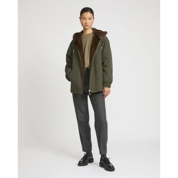 Woman wearing Yves Salomon shearling fur coat – luxury outerwear at Coveti