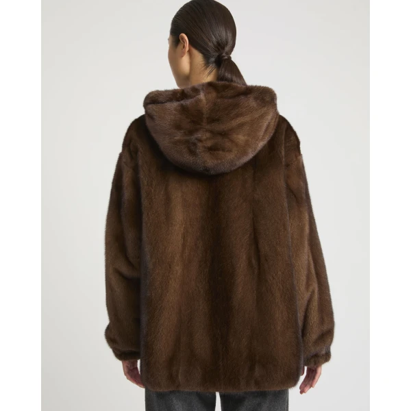 Woman wearing Yves Salomon shearling fur coat – luxury outerwear at Coveti