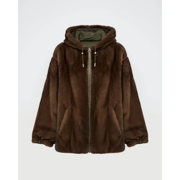 Woman wearing Yves Salomon shearling fur coat – luxury outerwear at Coveti