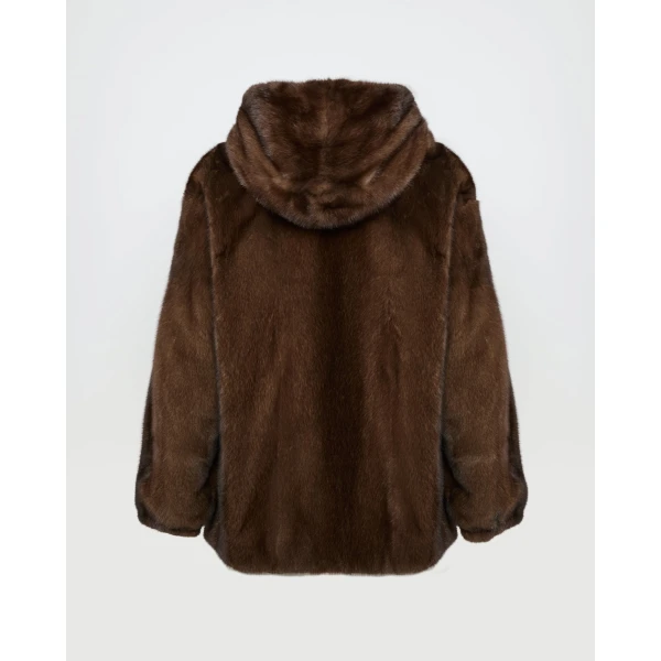 Woman wearing Yves Salomon shearling fur coat – luxury outerwear at Coveti
