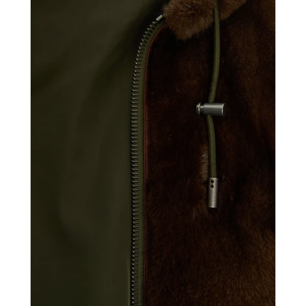 Woman wearing Yves Salomon shearling fur coat – luxury outerwear at Coveti