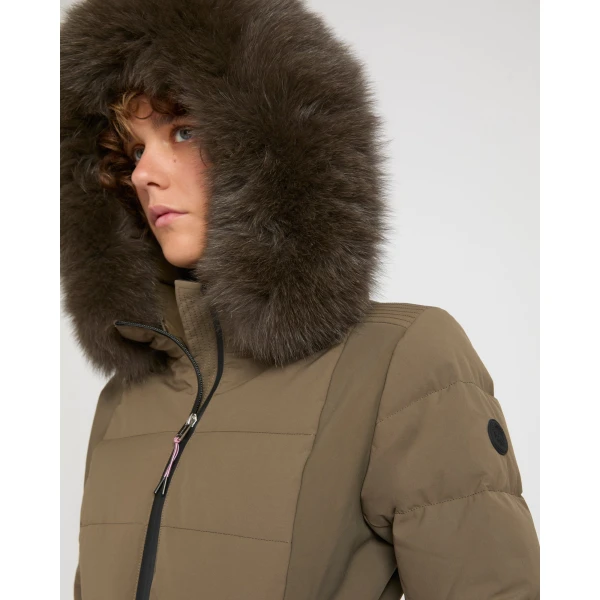 Woman wearing Yves Salomon shearling fur coat – luxury outerwear at Coveti