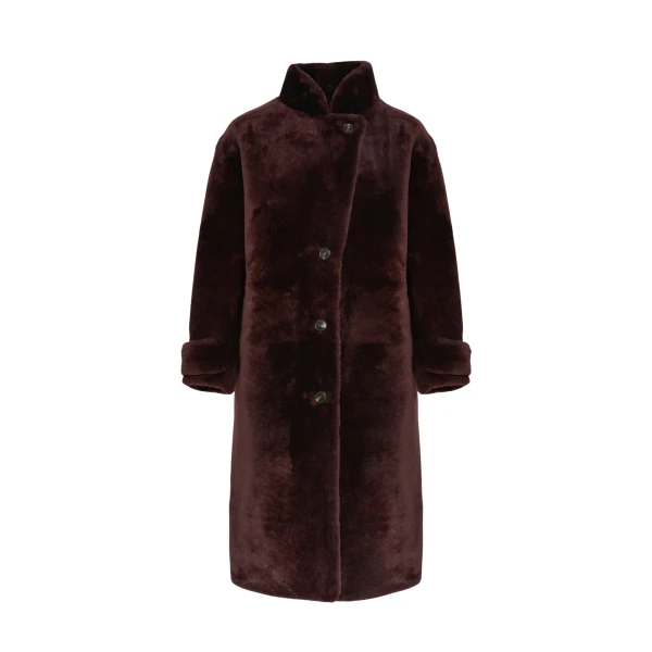Woman wearing Yves Salomon shearling fur coat – luxury outerwear at Coveti