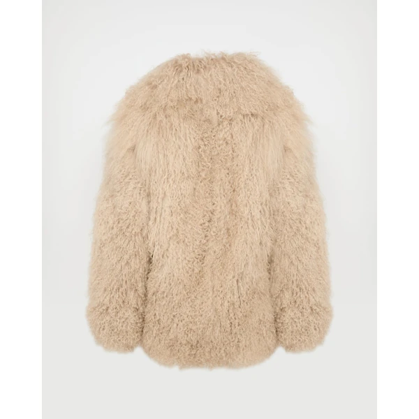 Woman wearing Yves Salomon shearling fur coat – luxury outerwear at Coveti