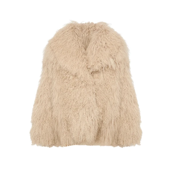 Woman wearing Yves Salomon shearling fur coat – luxury outerwear at Coveti