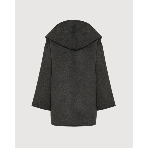 Woman wearing Yves Salomon shearling fur coat – luxury outerwear at Coveti
