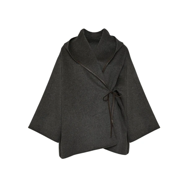 Woman wearing Yves Salomon shearling fur coat – luxury outerwear at Coveti
