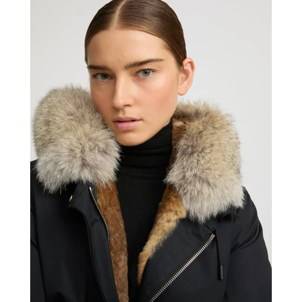 Woman wearing Yves Salomon shearling fur coat – luxury outerwear at Coveti