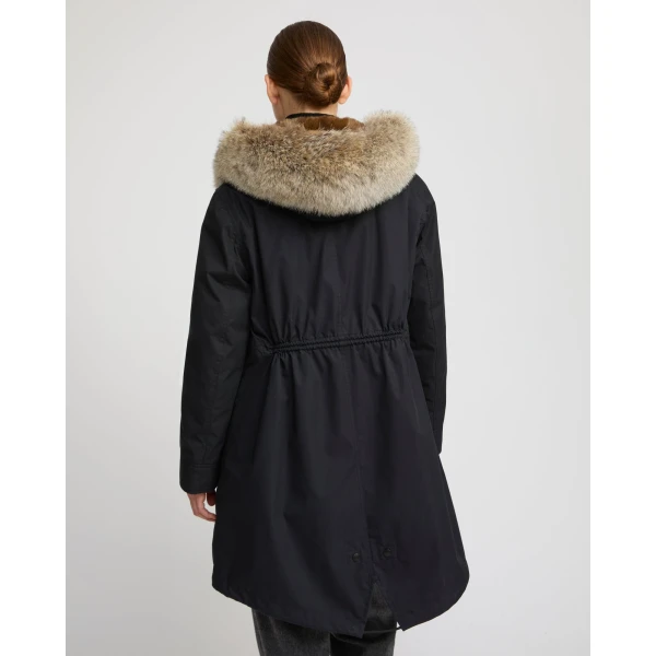 Woman wearing Yves Salomon shearling fur coat – luxury outerwear at Coveti