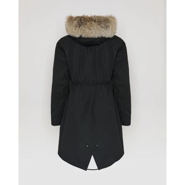 Woman wearing Yves Salomon shearling fur coat – luxury outerwear at Coveti