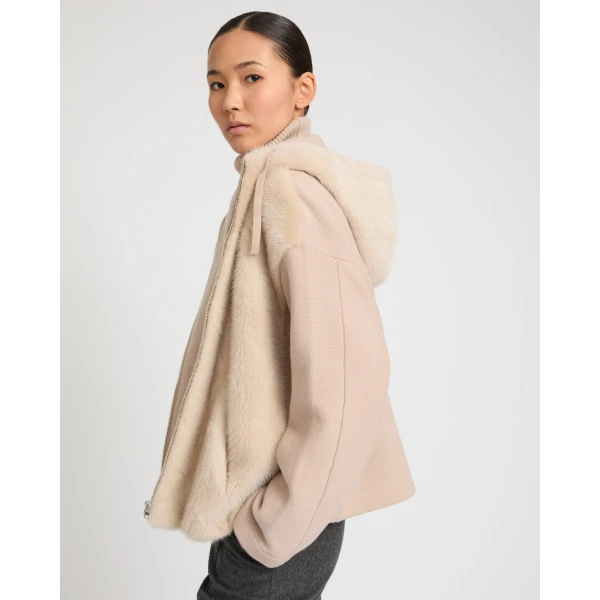 Woman wearing Yves Salomon shearling fur coat – luxury outerwear at Coveti